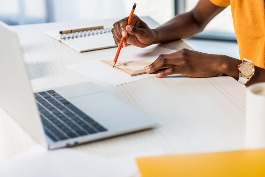 woman at workplace with laptop at home